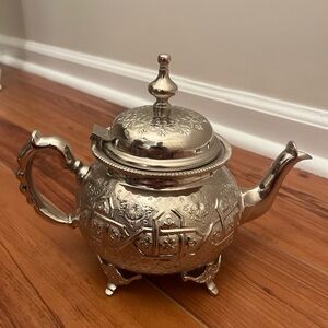 Intricately Designed Silver Teapot